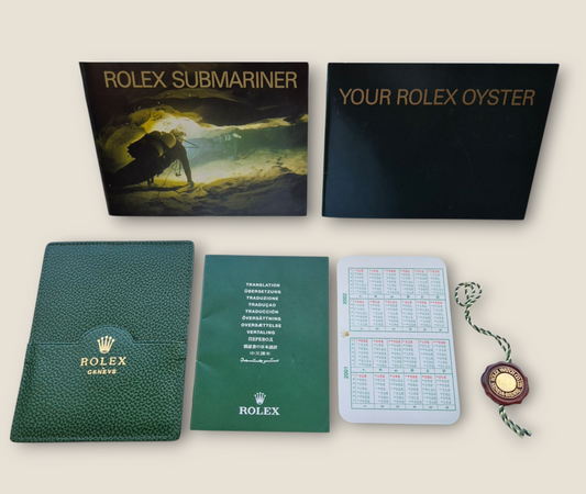 Rolex Submariner instruction manual 2002 594.52 Eng + Rolex wallet, Swing tag & Calendar card