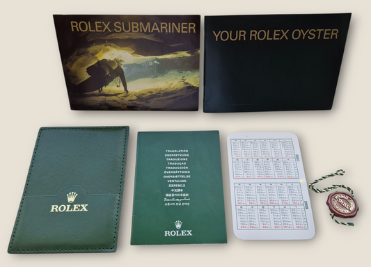 Rolex Submariner instruction manual 2008 594.52 Eng + Rolex wallet, Swing tag & Calendar card