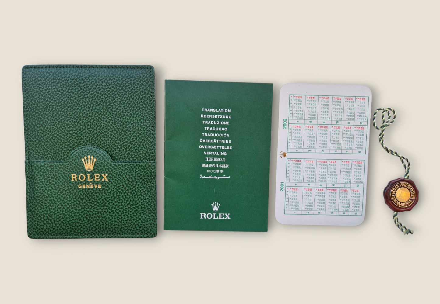 Rolex Submariner instruction manual 2002 594.52 Eng + Rolex wallet, Swing tag & Calendar card